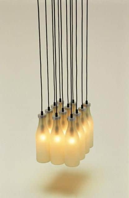 A multi-light cluster pendant chandelier featuring several frosted glass shades, each designed to re… — free GLB 3D model