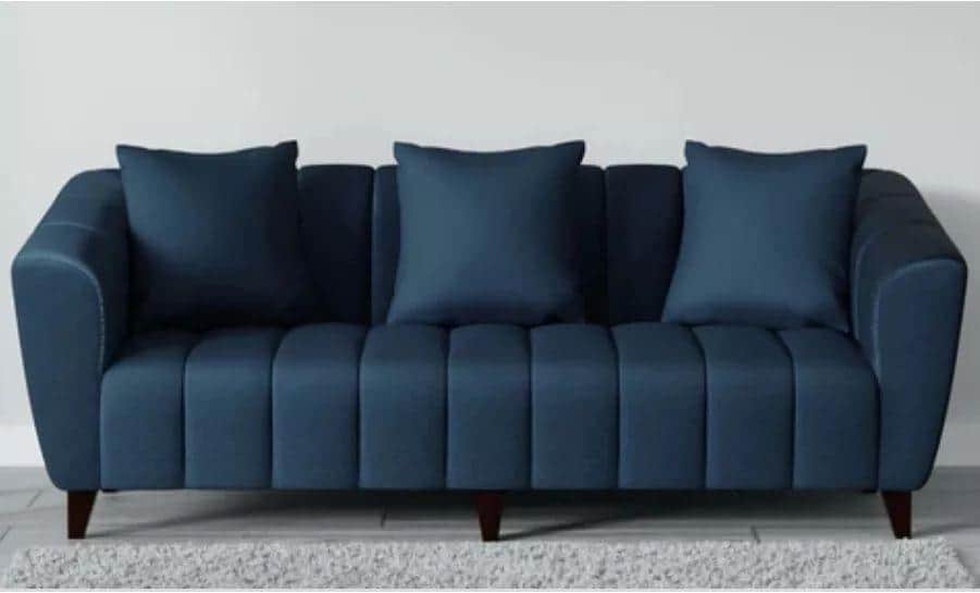 A contemporary blue sofa featuring prominent channel tufting on the seat and backrest, complemented… — 3D model
