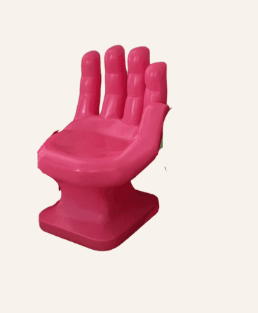 A vibrant pink novelty chair designed in the shape of an upright human hand. The fingers form the ba… — 3D model