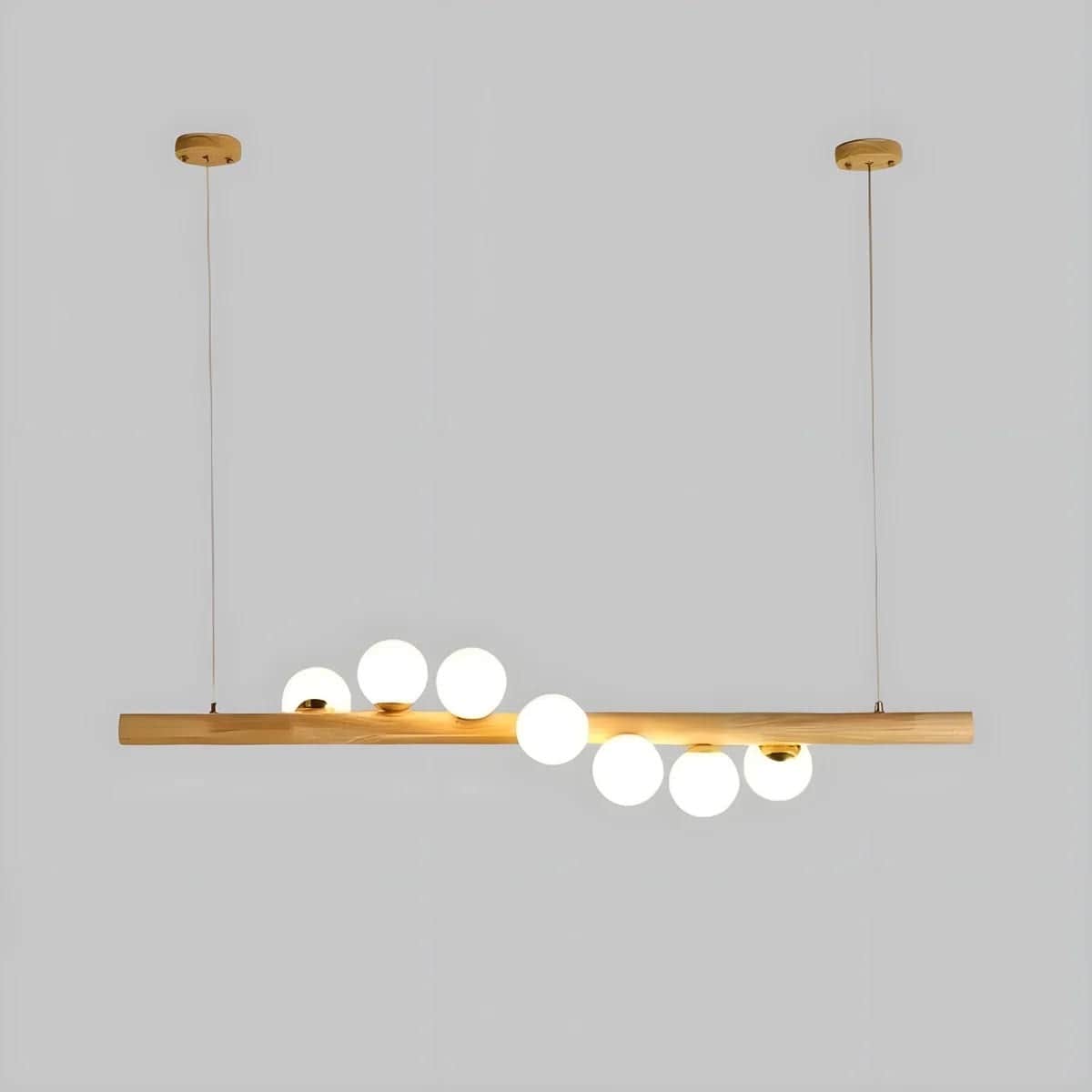 A modern linear pendant light featuring a horizontal wooden bar from which multiple spherical, frost… — 3D model