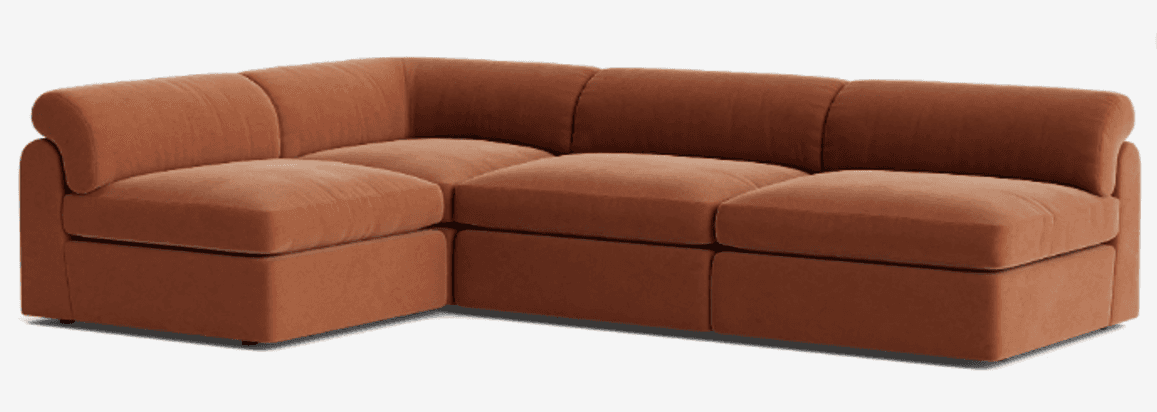 A modular sectional sofa featuring a curved armrest on one end and a modular seating arrangement. Th… — 3D model