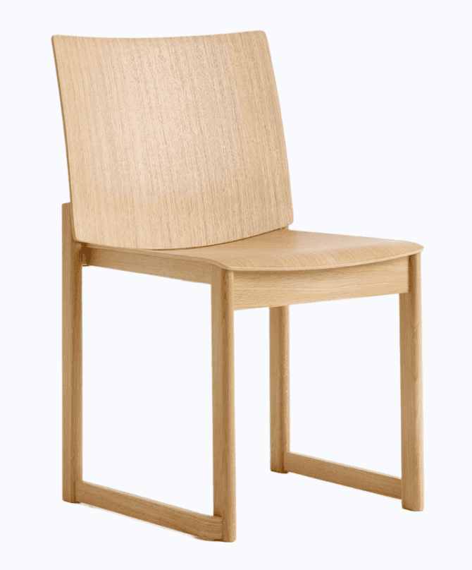 A modern side chair constructed from light-colored wood, featuring a curved backrest and a contoured… — 3D model