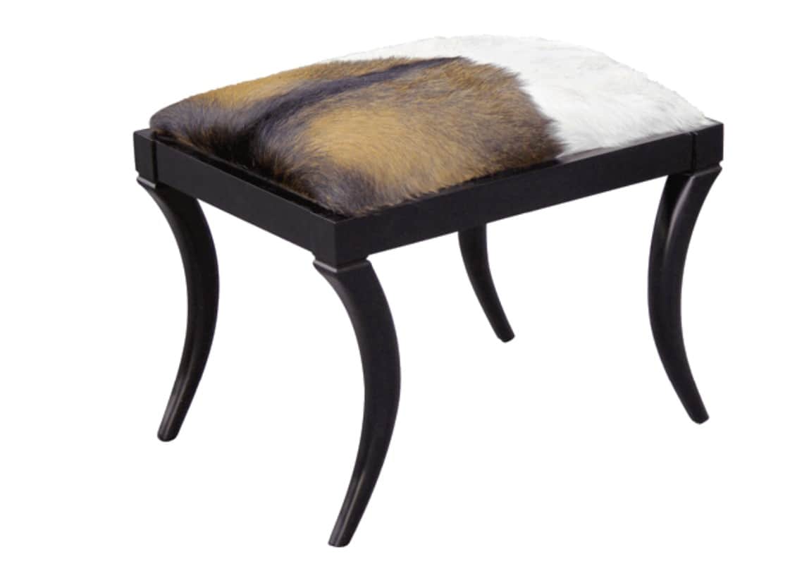 A small, rectangular stool featuring a cowhide upholstered top in natural brown, white, and black pa… — free GLTF 3D model