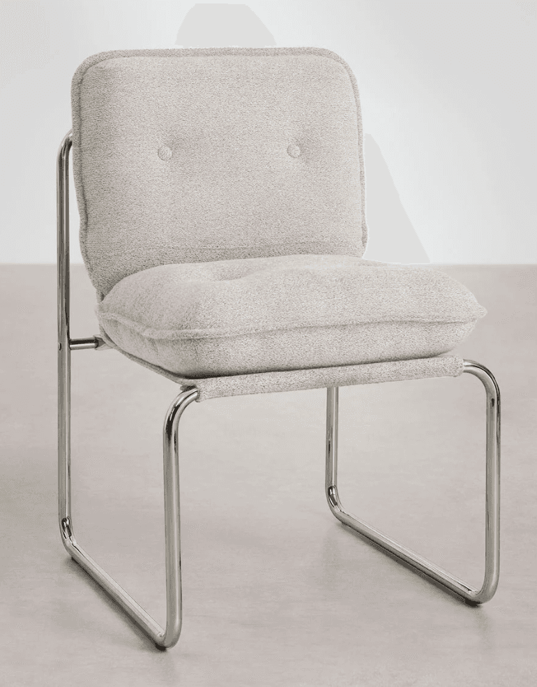 An armless chair featuring a cantilever frame constructed from polished tubular chrome. It has two s… — 3D model