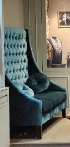 A high-back armchair upholstered in a teal or turquoise velvet-like fabric, featuring deep button tu… — free OBJ 3D model