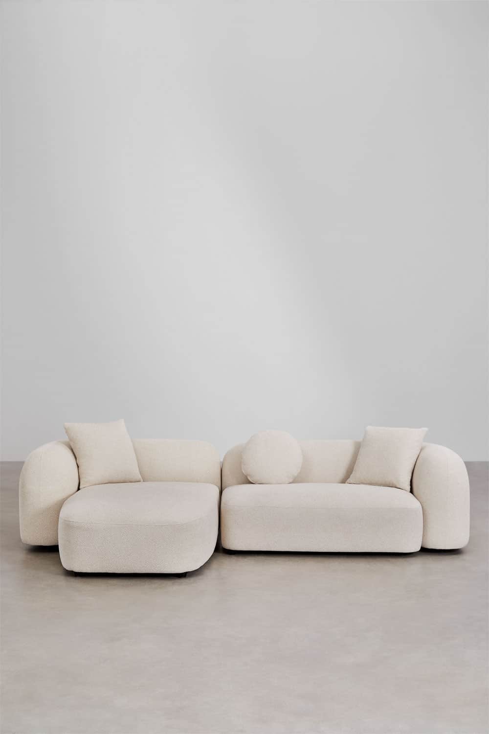 A contemporary L-shaped sectional sofa consisting of two modular pieces: a main sofa unit and an ext… — 3D model