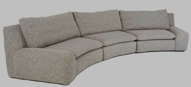 A contemporary, light grey upholstered modular sectional sofa featuring a distinct curved design. It… — 3D model
