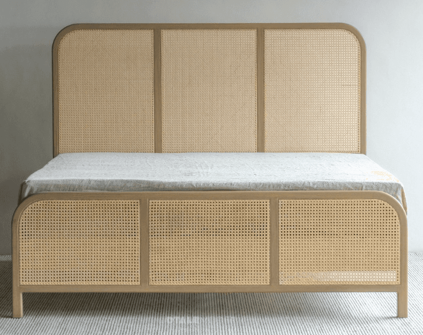 A modern platform bed frame featuring a light-toned wooden structure with cane webbing inserts on bo… — 3D model