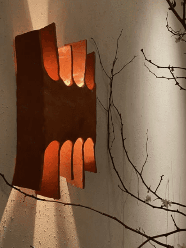 A contemporary wall sconce crafted from terracotta, featuring a rectangular form with multiple arche… — 3D model