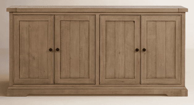 A wooden sideboard featuring four cabinet doors arranged in two symmetrical pairs. Each door has a v… — 3D model