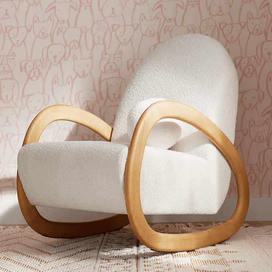 A contemporary rocking chair featuring a plush, off-white boucle upholstered seat and back, supporte… — 3D model