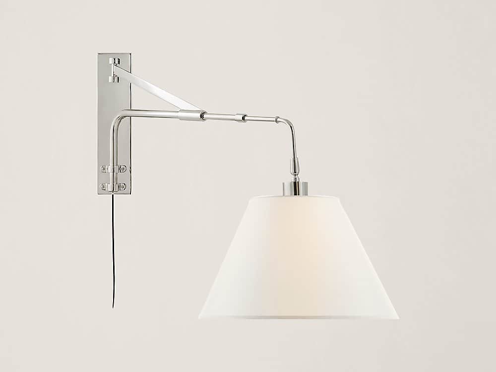 A modern wall-mounted swing arm lamp with a polished metal finish and a white conical shade. The arm… — 3D model