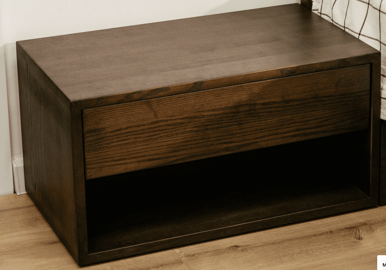 A compact, rectangular nightstand crafted from dark stained wood, featuring a single, handle-less dr… — 3D model