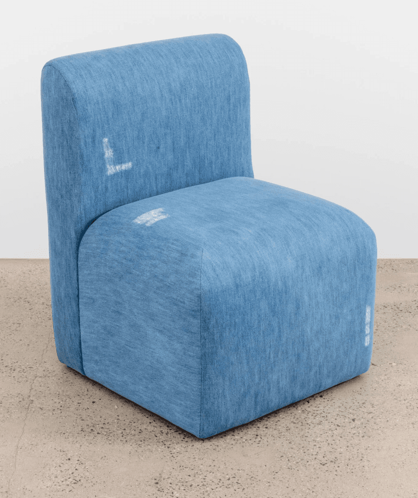 A modern armchair with a compact, blocky design. It features a low-profile seat and a slightly curve… — 3D model