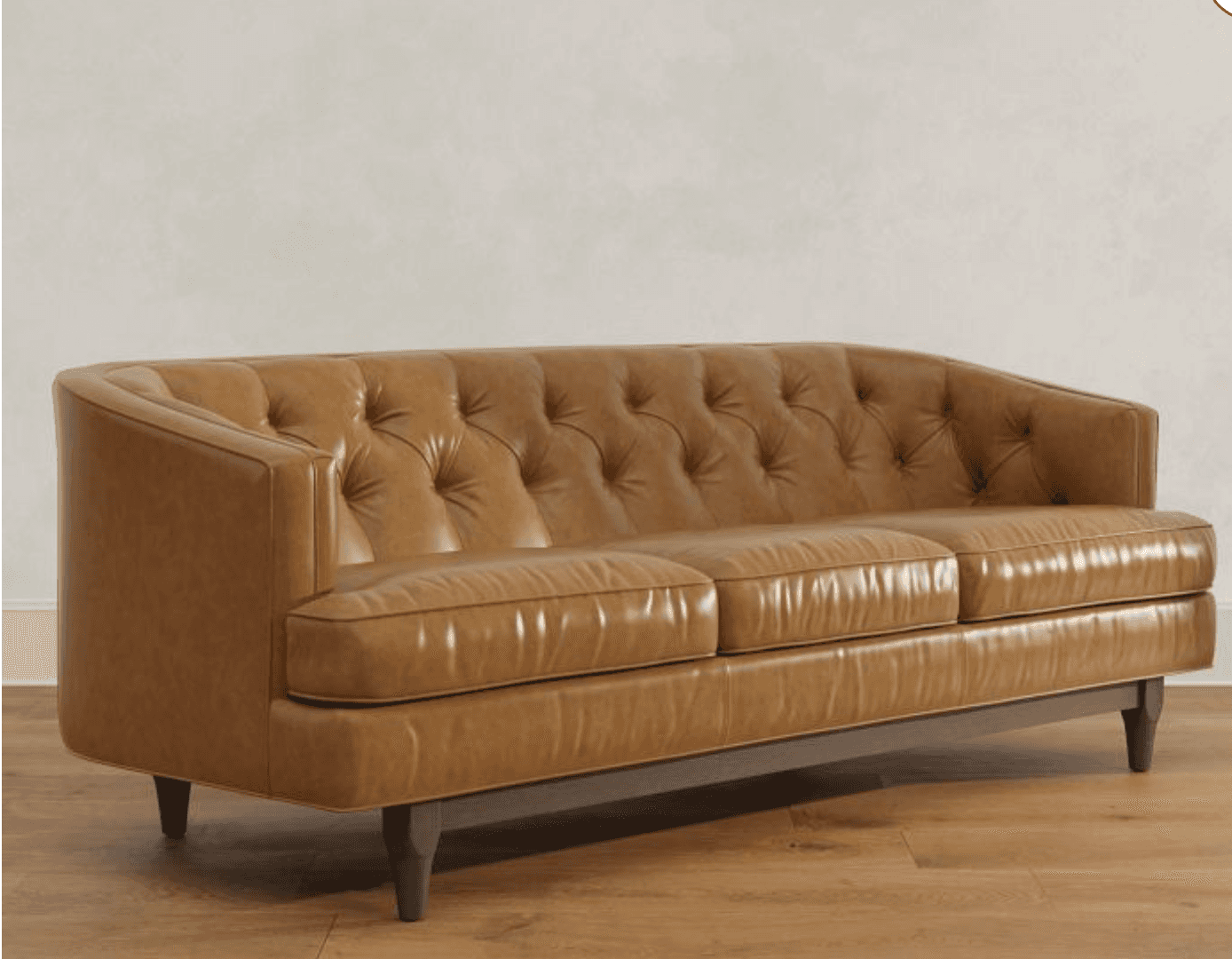 A three-seater sofa with a curved back and arms. The upholstery features tufted detailing on the bac… — 3D model