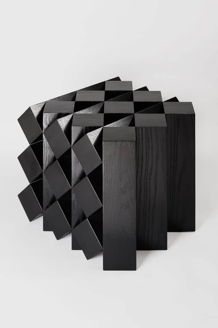 A contemporary black cabinet with a striking geometric design. The front facade is composed of an ar… — free OBJ 3D model