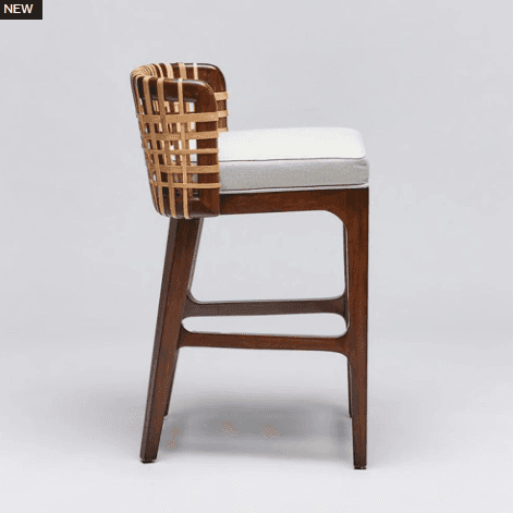 A modern bar stool with a wooden frame and a woven backrest. The seat is upholstered in a light-colo… — 3D model