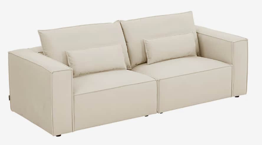 A modern two-seater sofa, presented in a studio shot, featuring a modular design. It is upholstered… — 3D model