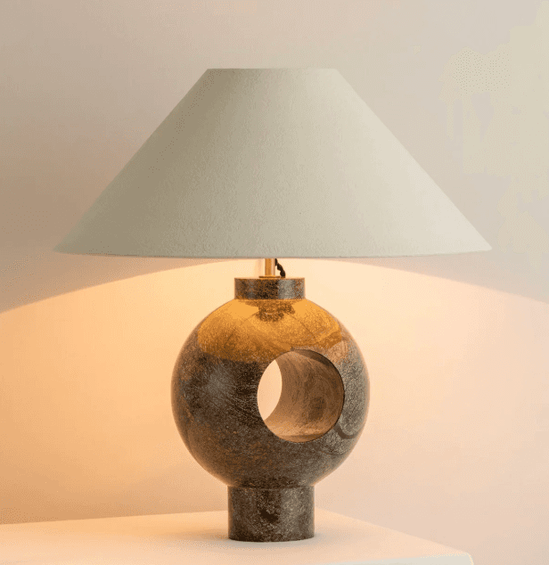 A table lamp with a conical shade and a spherical base. The base is made of a polished stone with va… — 3D model
