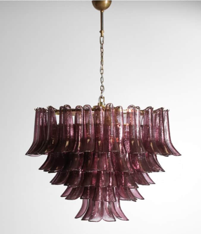 A vintage chandelier with multiple tiers of amethyst-colored glass elements suspended from a brass-t… — 3D model
