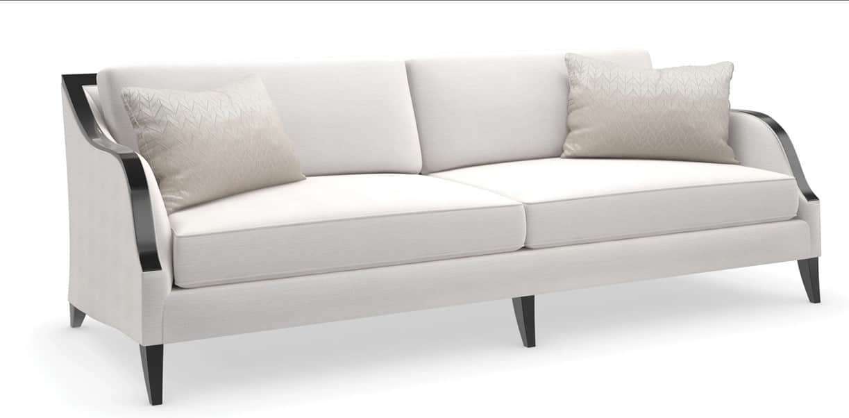 A contemporary sofa featuring light-colored upholstery, exposed dark wood arms with a curved design,… — free GLTF 3D model
