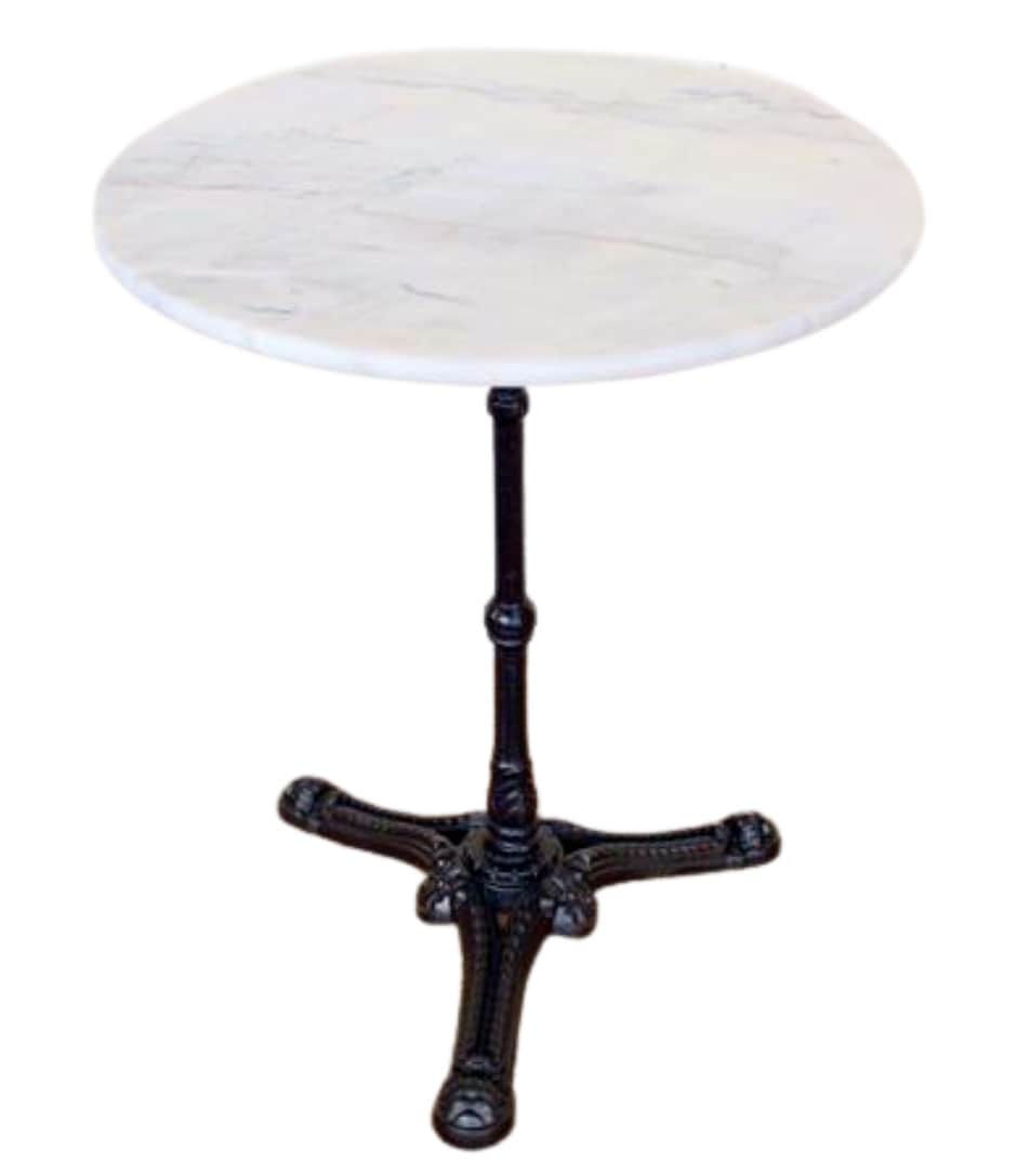 A round bistro table featuring a white marble top with subtle grey veining, supported by a single, d… — 3D model