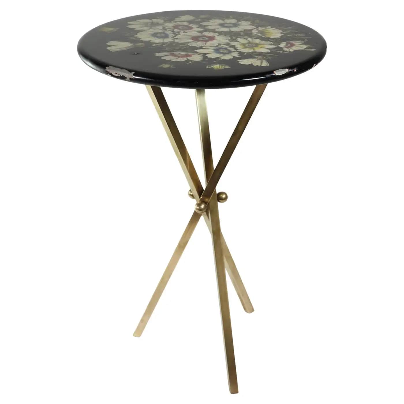 A small, round black table featuring a multi-color floral motif painted on its lacquered top, suppor… — free STL 3D model