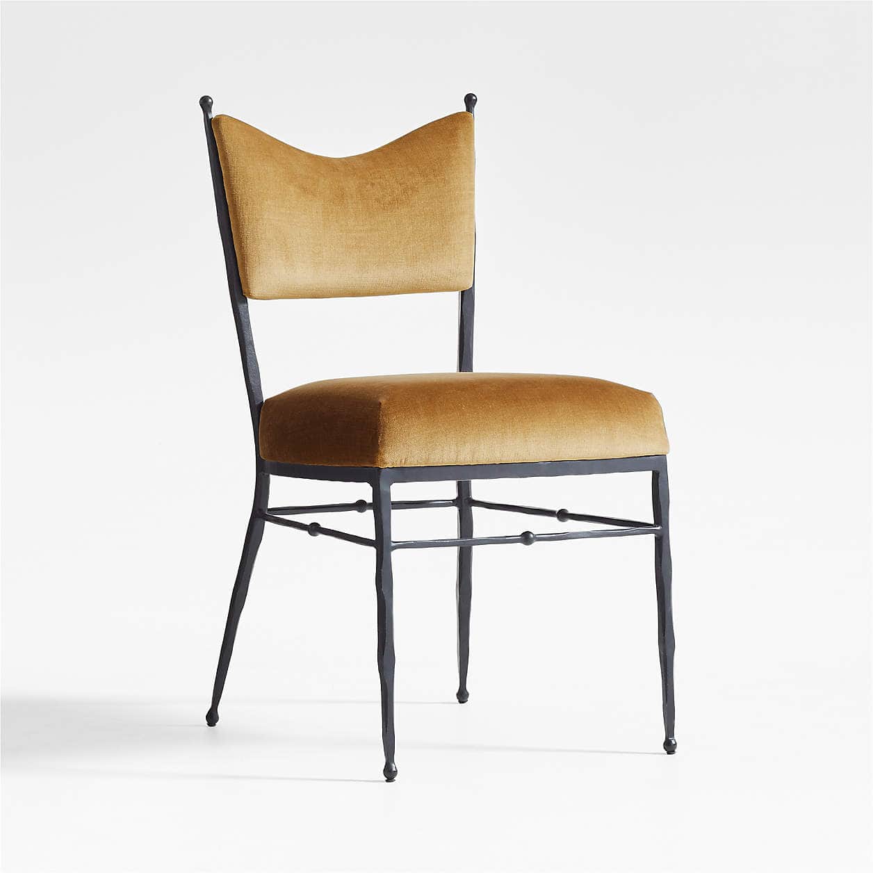 A chair with a dark, metallic frame and a cushioned seat and back. The frame appears to be wrought i… — free FBX 3D model