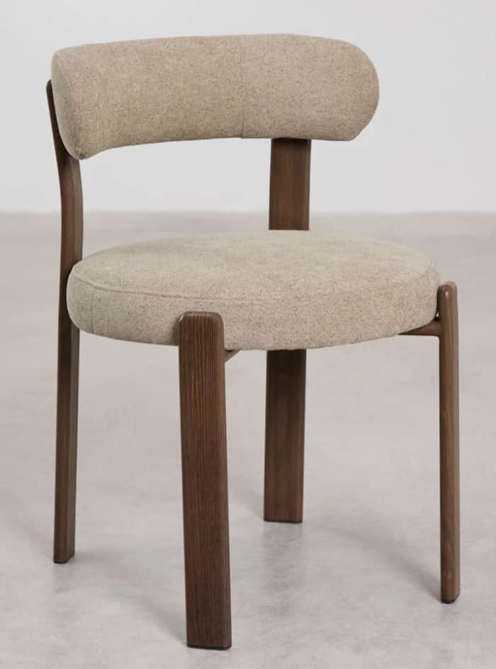 A modern dining chair with a rounded upholstered seat and backrest supported by a dark wood frame. T… — 3D model
