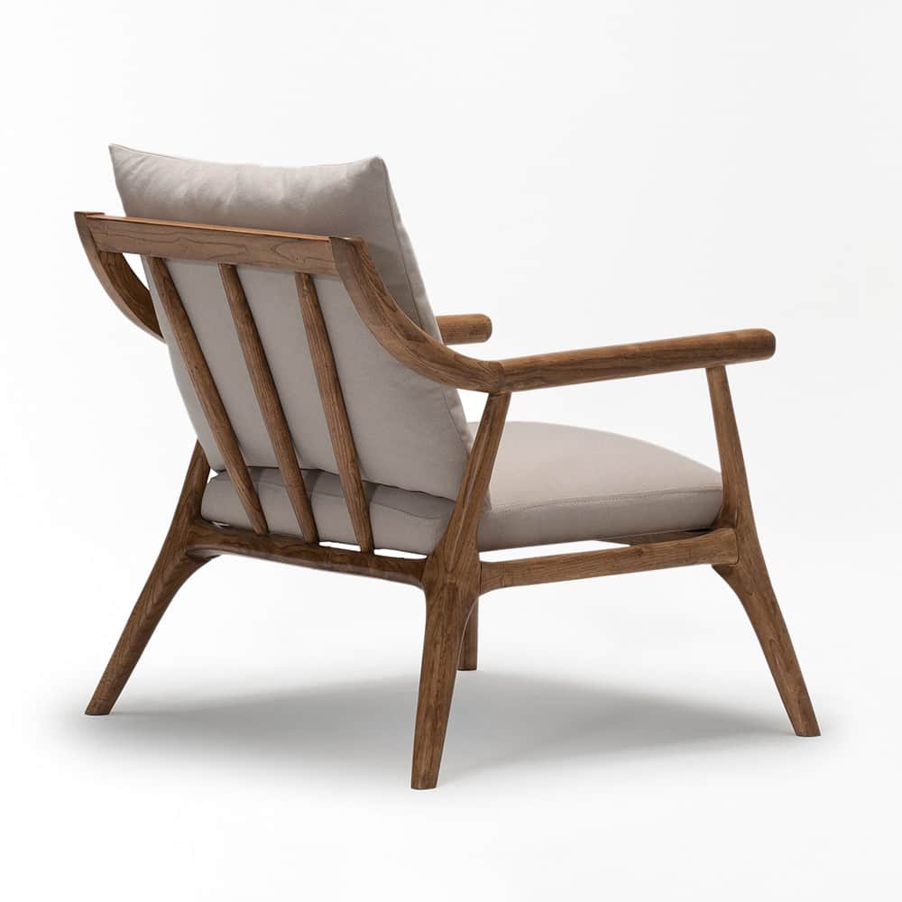A contemporary lounge chair featuring a solid wooden frame with a warm brown finish and light-colore… — 3D model