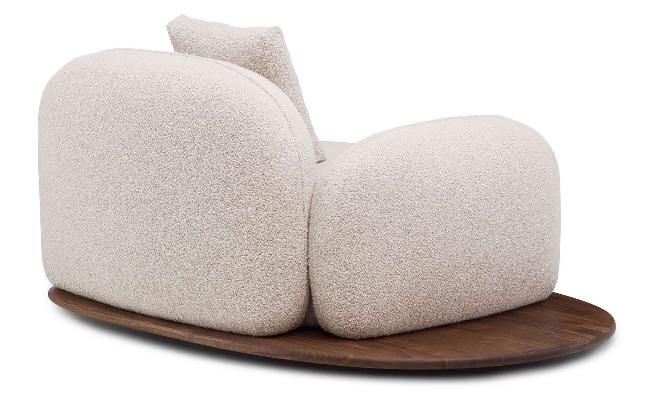 An armchair with a rounded, organic form, featuring a textured boucle fabric upholstery in a light n… — free BLEND 3D model