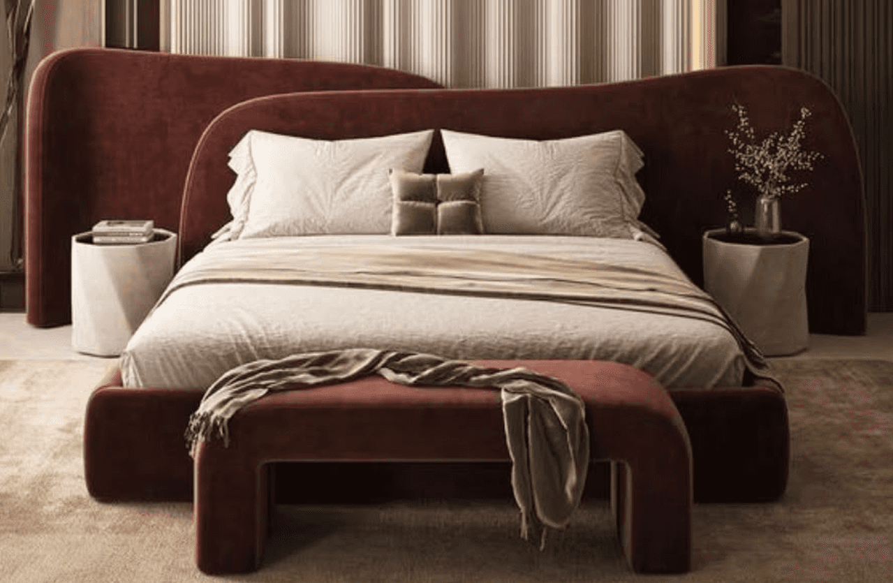 An upholstered daybed featuring a continuous, seamless design, covered in a reddish-brown velvet-lik… — 3D model