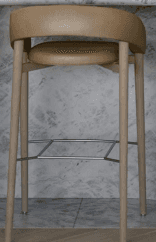 A modern bar stool featuring a round upholstered seat and a continuous, curved upholstered backrest… — 3D model