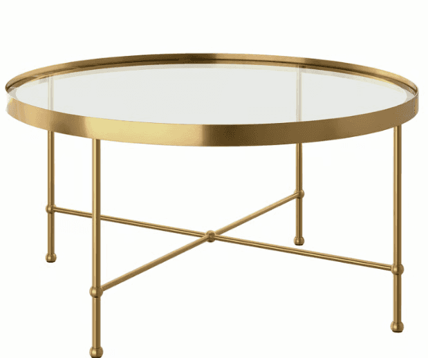 A modern round coffee table featuring a clear glass tabletop set within a polished brass-finished me… — 3D model