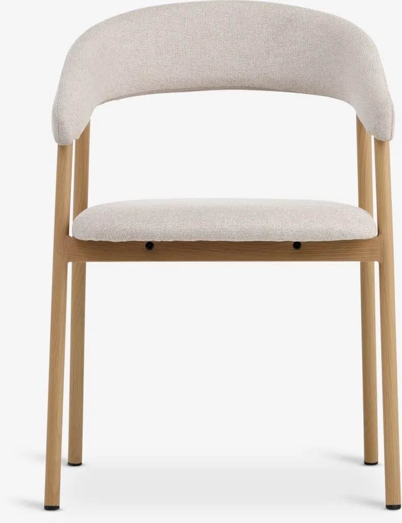 An upholstered dining chair featuring a light natural wood frame and a light beige, textured fabric.… — 3D model
