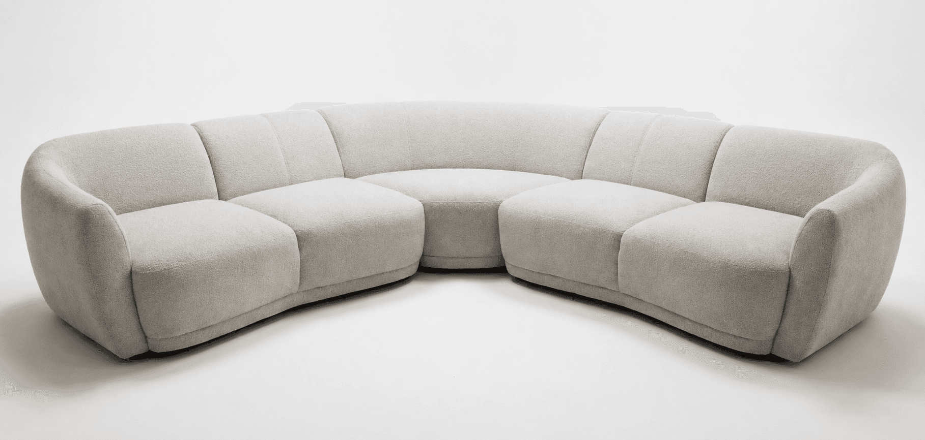 A light grey, modular sectional sofa with a distinctly curved form, upholstered in a textured, boucl… — 3D model