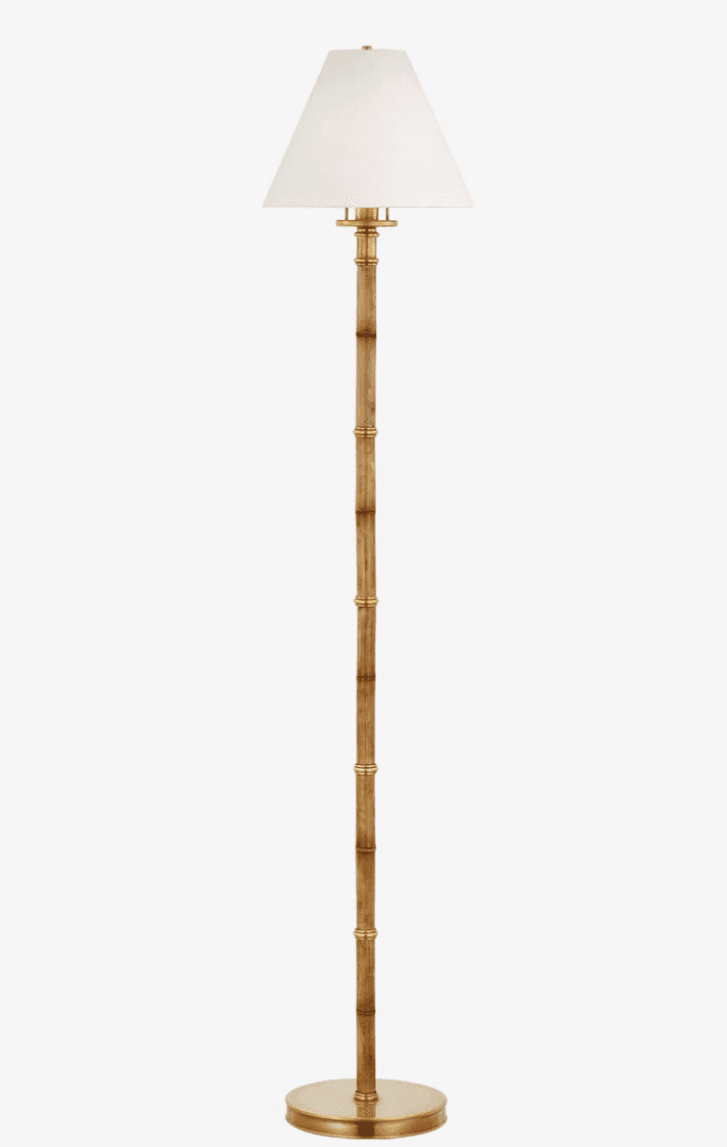 A tall floor lamp featuring a slender, textured stalk designed to mimic bamboo, with polished brass… — free GLTF 3D model