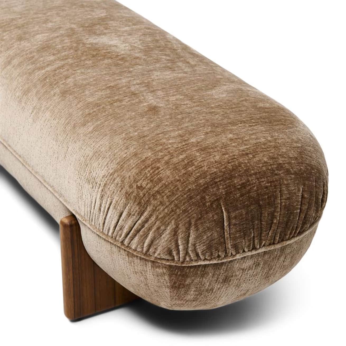A low-profile, elongated bench with a rounded, upholstered form and solid wood legs. The upholstery… — free OBJ 3D model