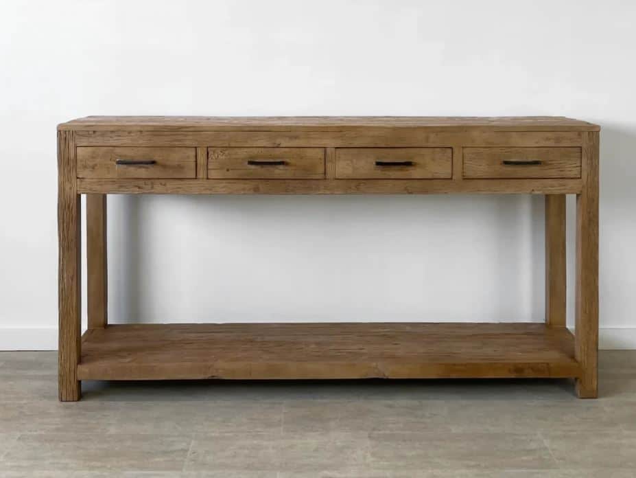 A rectangular console table with a weathered wood finish, featuring four drawers across the top and… — 3D model