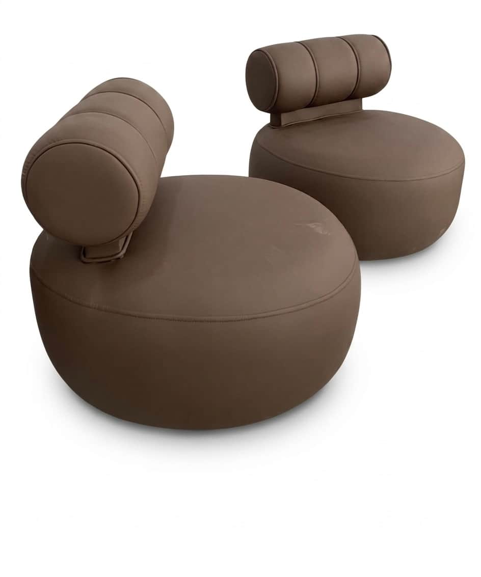 A modern, armless lounge chair featuring a low-slung, circular seat and a distinctive cylindrical bo… — 3D model