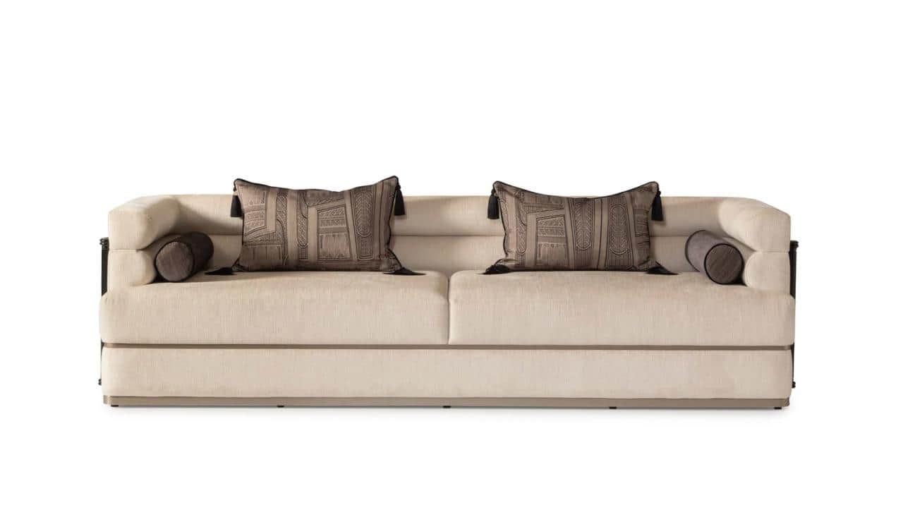 A modern upholstered sofa featuring a light-colored fabric, distinct dark wood and black metal arm d… — free GLTF 3D model