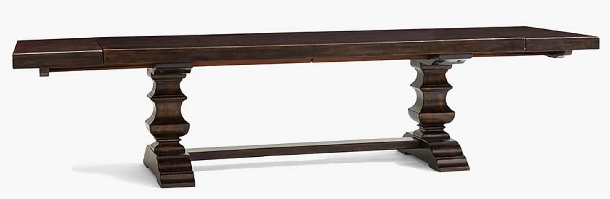 A dark brown, rectangular dining table with a thick, solid wood top. The table is supported by two s… — 3D model