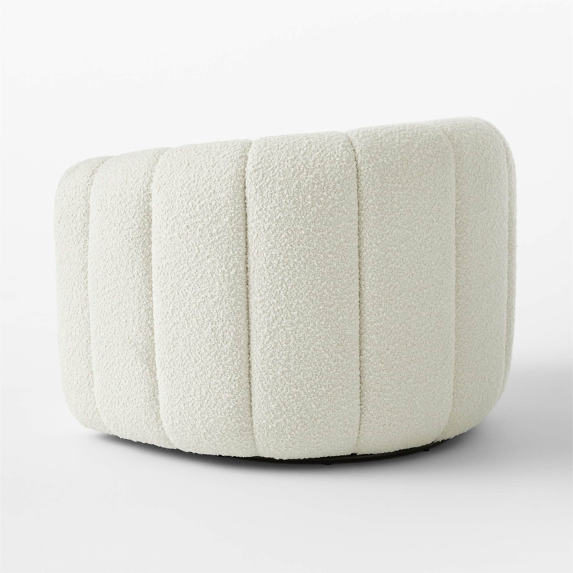 A cream-colored, rounded ottoman with vertical channel tufting across its exterior. The upholstery h… — 3D model