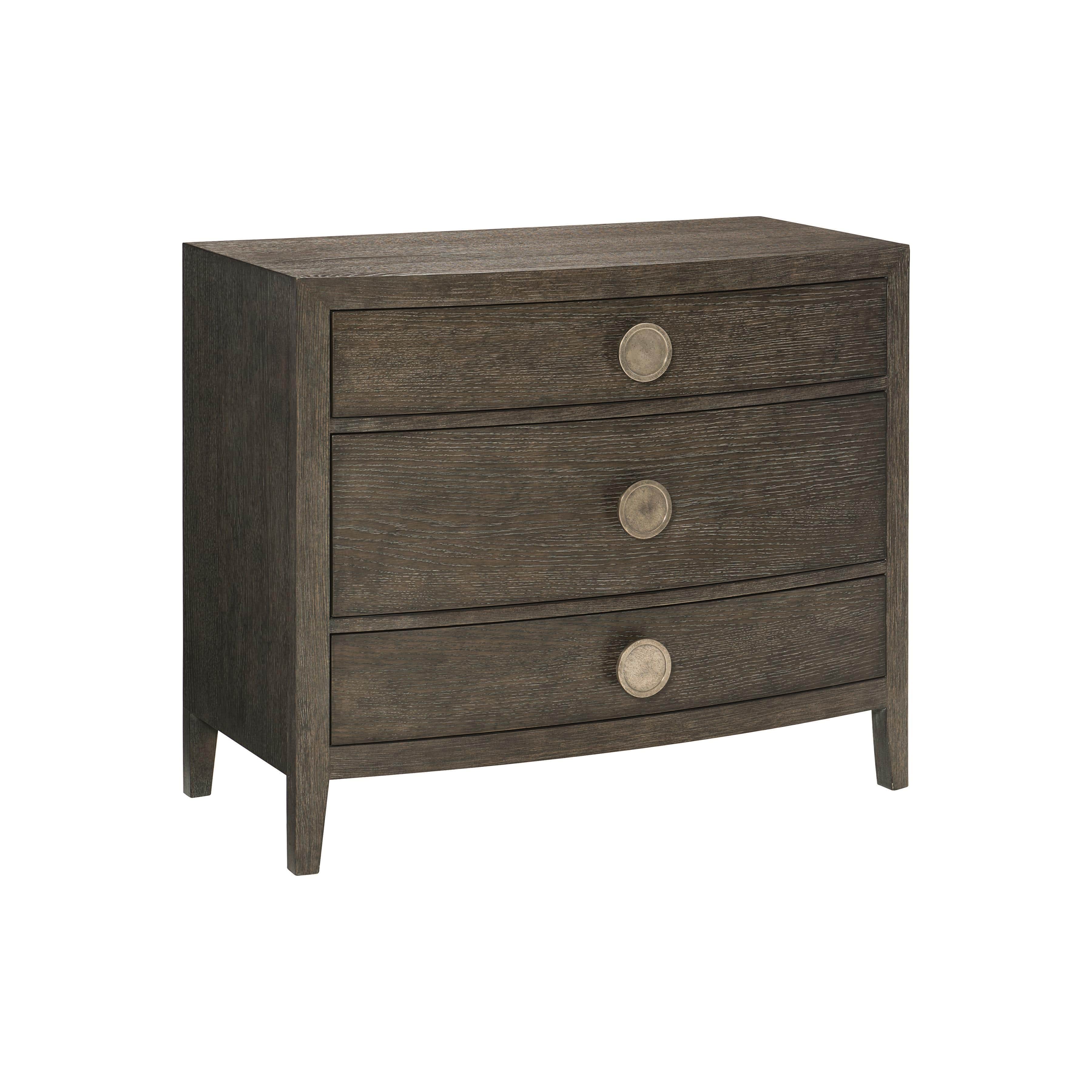 A three-drawer nightstand with a dark wood finish and curved drawer fronts. Each drawer is adorned w… — 3D model