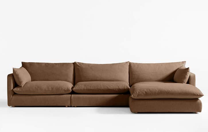 A large, modular sectional sofa upholstered in a neutral taupe-brown fabric. It features a three-sea… — 3D model