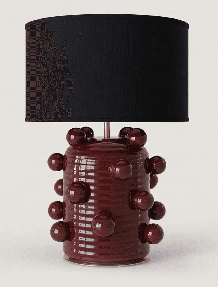 A decorative table lamp featuring a cylindrical ceramic base with a ribbed texture and numerous appl… — 3D model