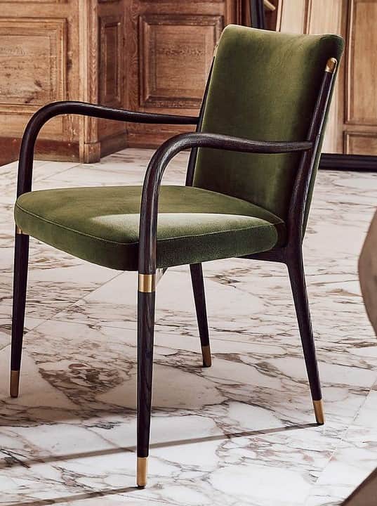 A modern upholstered armchair featuring a dark bentwood frame, green fabric upholstery, and decorati… — free OBJ 3D model