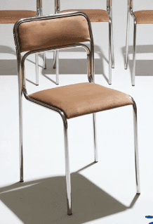 A modern armless chair featuring a polished tubular steel frame and upholstered seat and backrest in… — 3D model