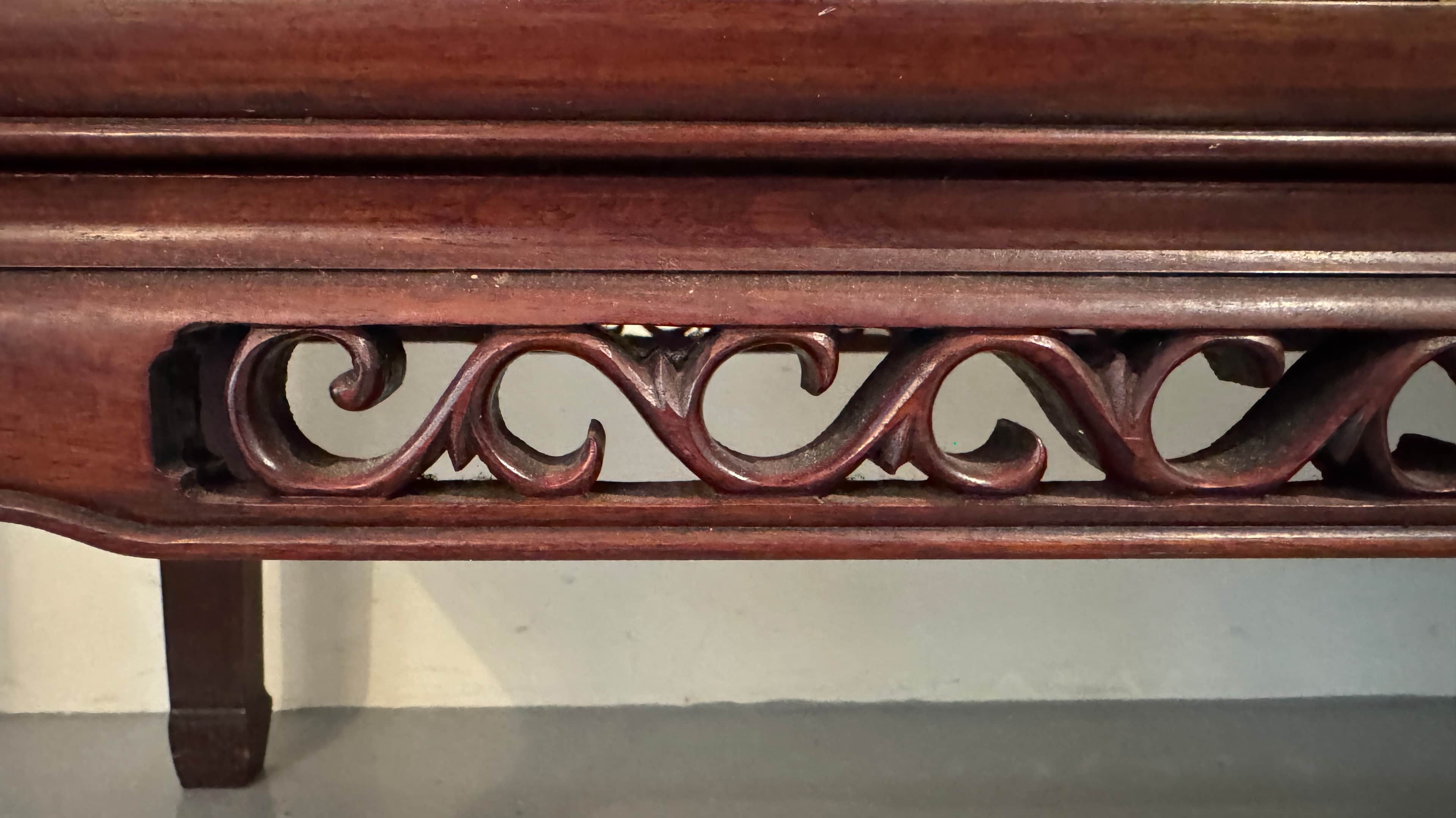 A dark brown, rectangular wall shelf with decorative carved scrolling patterns on its front apron. T… — free BLEND 3D model