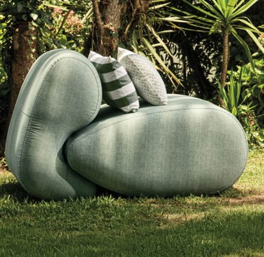 An upholstered lounge chair with an organic, sculptural form, featuring a light green textured fabri… — free OBJ 3D model